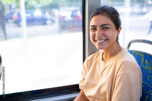 Indian Smiling Woman ride in public transport bus or tram