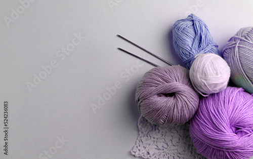 Yarn and balls for knitting, on table photo