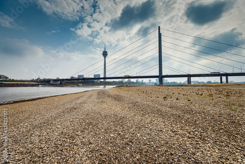 Low Rhine level in Düsseldorf with Rhine tower and bridge 2022  photo