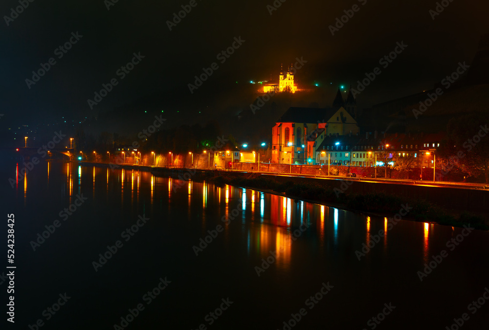 Wurzburg Germany in the night . Main river in the nighttime . Night city reflection in the water 