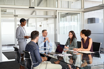 Formal business people in meeting room
