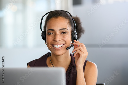 Fotografija Black beautiful woman smiling during business phone call