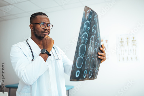 MRI digital x-ray of brain with radiologist doctor oncology working in clinic hospital. Medical healthcare concept. Medical experts studies the EEG condition of the patient. Doctors Examining X-Ray