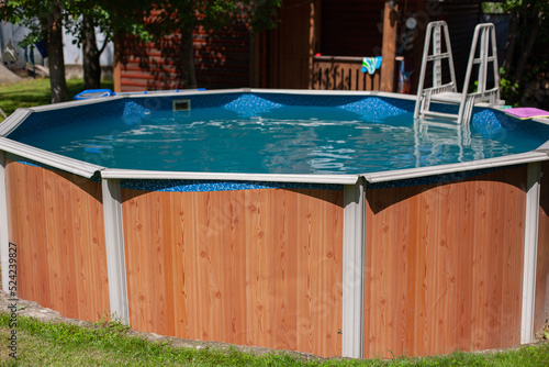Obraz na plátně Swimming Summer pool in the yard