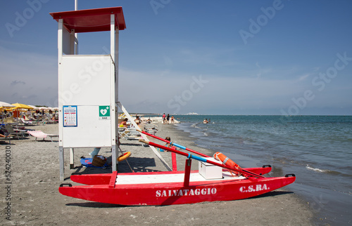 Red lifeguard rescue boat. The word 