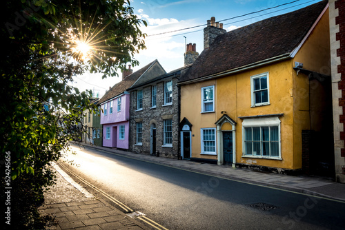 Photo Sun shining along typical street of Sudbury in Suffolk