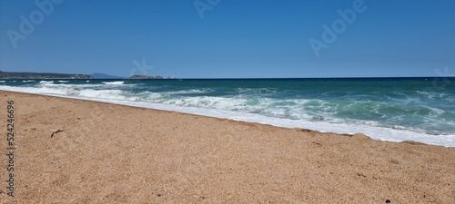 Pals, Costa Brava, Spain July 2022, beach and sea against blue sky with Illes Medes in beautiful weather