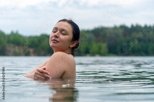 Portrait of a girl of Caucasian appearance in the lake.