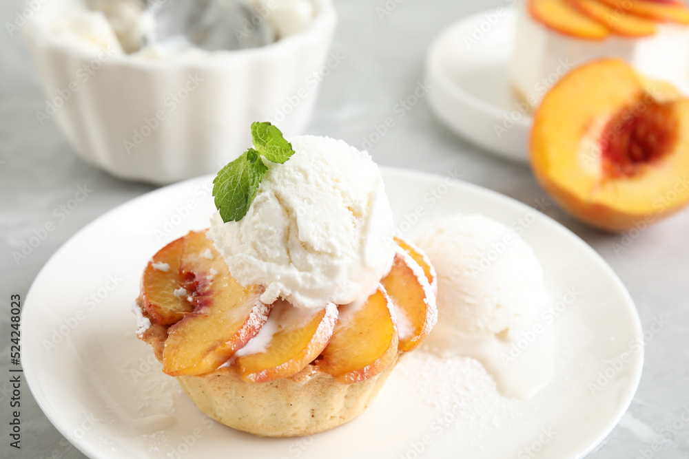 Delicious peach dessert with ice cream on table, closeup Delicious peach dessert with ice cream on table, closeup