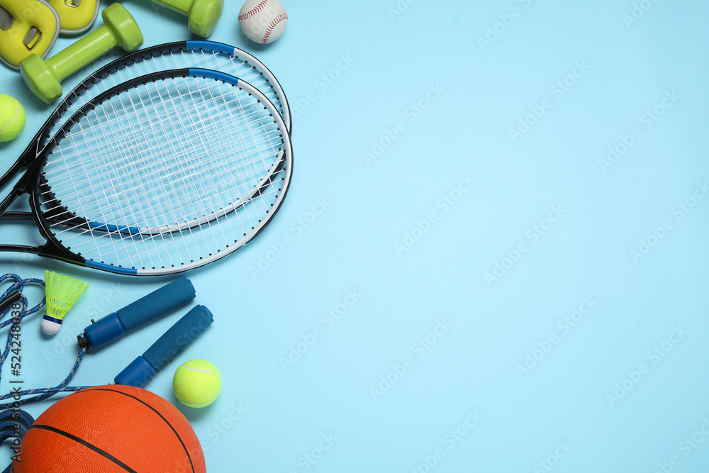 Set of different sports equipment on light blue background, flat lay. Space for text