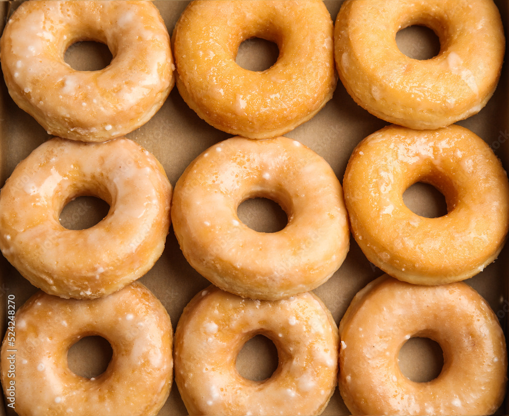Delicious donuts on white wooden table, top view Delicious donuts on white wooden table, top view