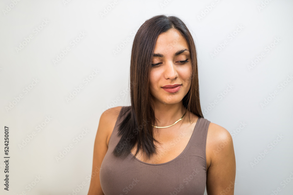 Close-up of a beautiful sexy brunette with a big bust on a white background. Close-up of a beautiful sexy brunette with a big bust on a white background.