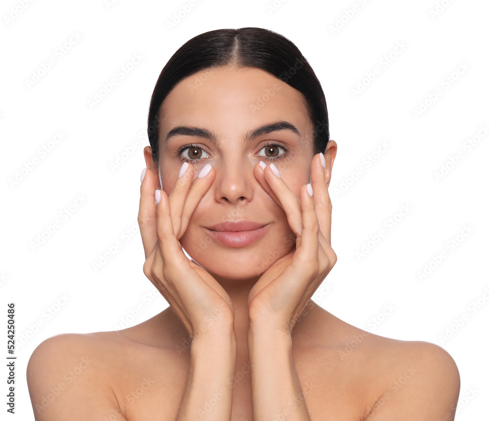 Beautiful young woman touching skin around eyes on white background Beautiful young woman touching skin around eyes on white background