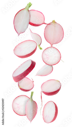Fresh ripe radishes falling on white background