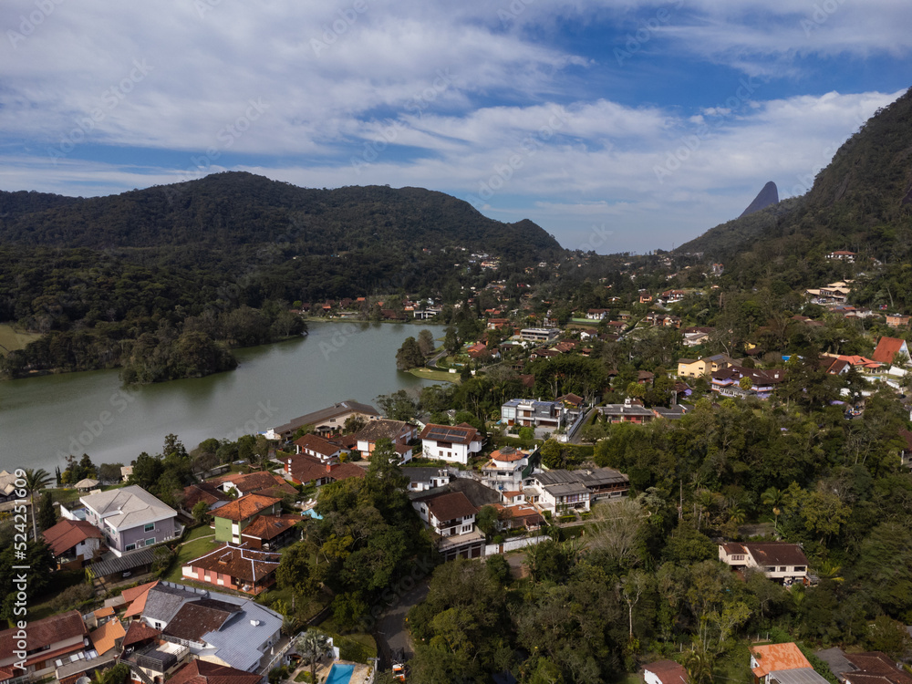 Aerial view of Granja Comary, Carlos Guinle neighborhood in the city of Teresópolis. Mountain region of Rio de Janeiro, Brazil. Drone photo. Houses, lake and hills and mountains