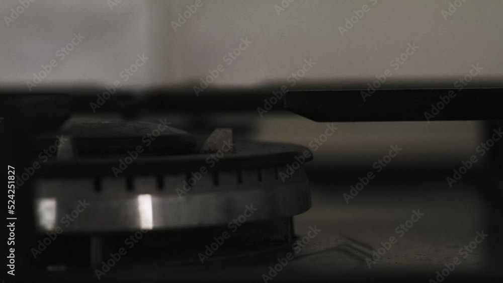 the gas burner on the stove is lit the gas burner on the stove is lit