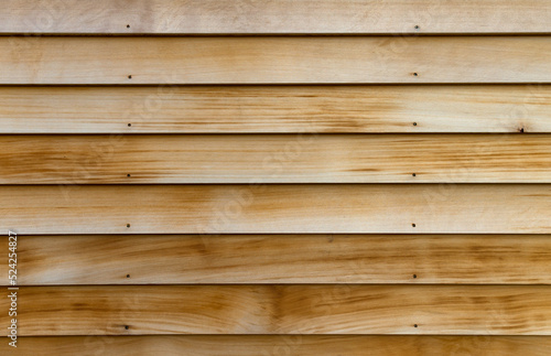 Horizontal rows of cedar wood siding as an exterior wall