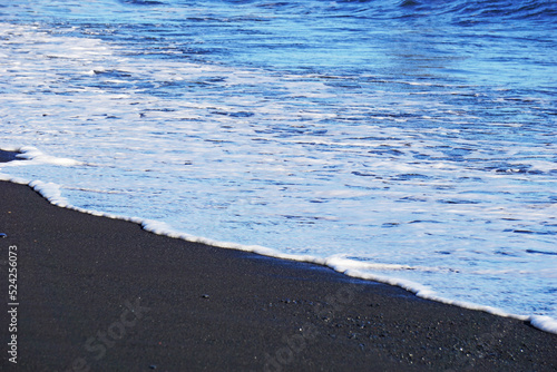 Reynisfjara - black beach in Iceland, close-up on waves