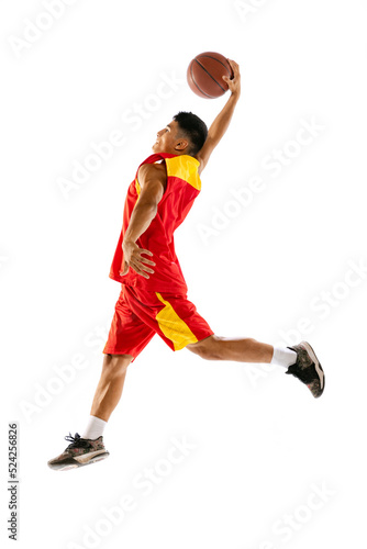 Portrait of young man, basketball player in motion, training isolated over white studio background © Lustre