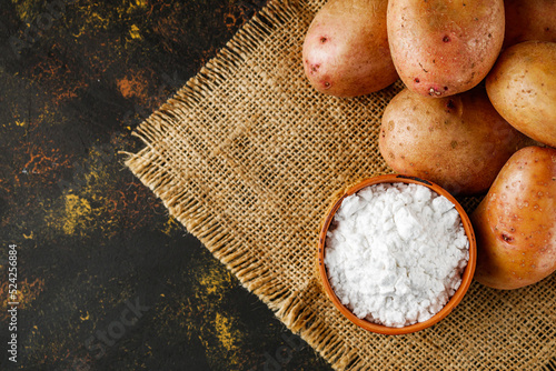 potato starch on a dark rustic background photo