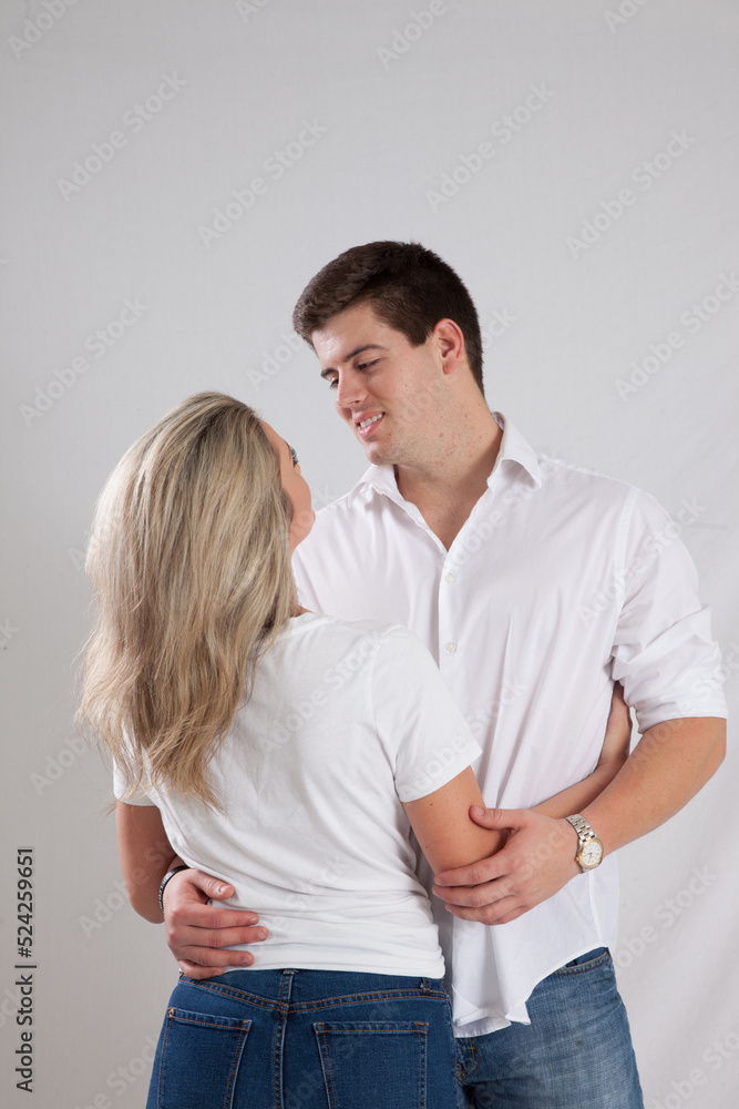 Romantic couple smiling together with joy Romantic couple smiling together with joy