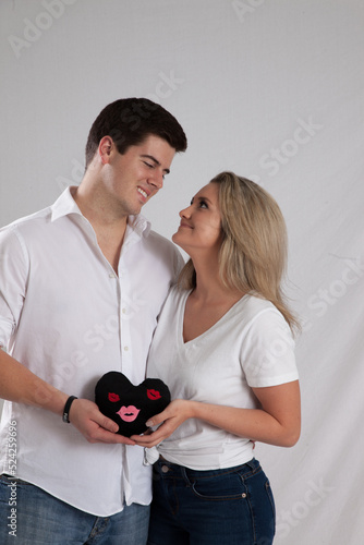 Romantic couple with a stuffed heart