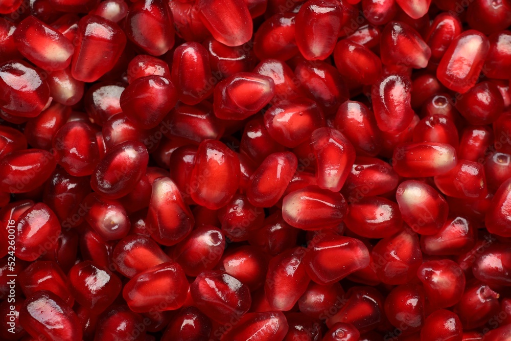 Tasty pomegranate seeds as background, top view Tasty pomegranate seeds as background, top view