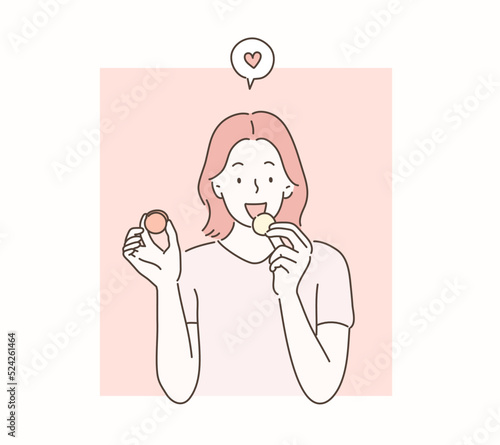 She is eating macaroons. hand drawn style vector design illustrations. 