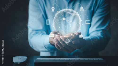 Billede på lærred Businessmen with hologram icon online data network connection, upload data to cloud so that the data can be transferred to other devices and can be viewed online any time