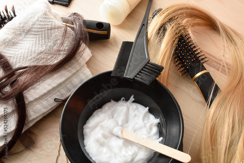 Obraz na plátně Detail of hair treatment products on wooden table top view