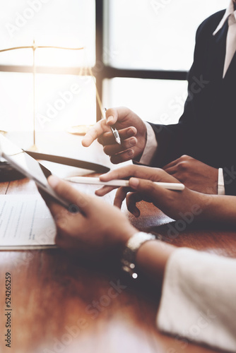 The client is consulting with a lawyer on legal matters