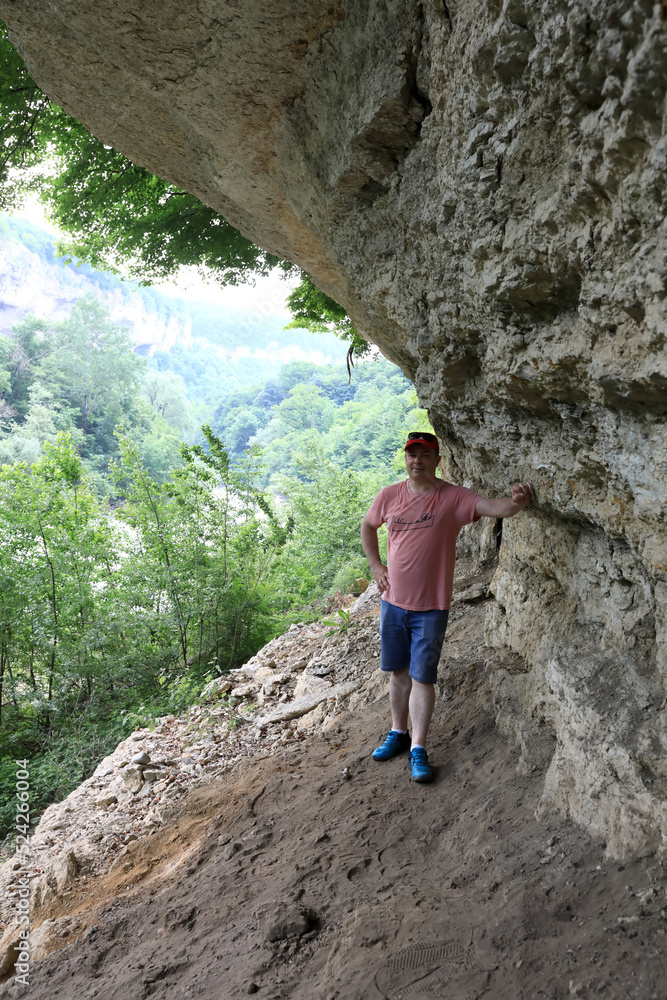 Man in grotto of Belaya river valley Man in grotto of Belaya river valley