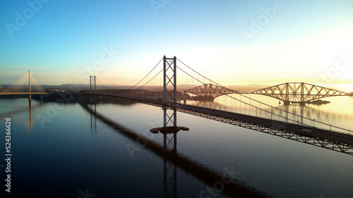 Aerial drone sunrise view of The Queensferry Crossing bridges over the Firth of Forth, Edinburgh, Scotland, UK.
