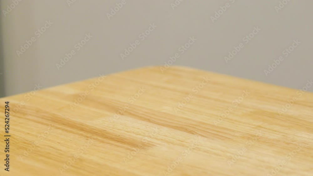 Hand take a gyoza with sauce in a plate from a wooden table, Food and service concept, Japanese and Chinese food concept. Hand take a gyoza with sauce in a plate from a wooden table, Food and service concept, Japanese and Chinese food concept.