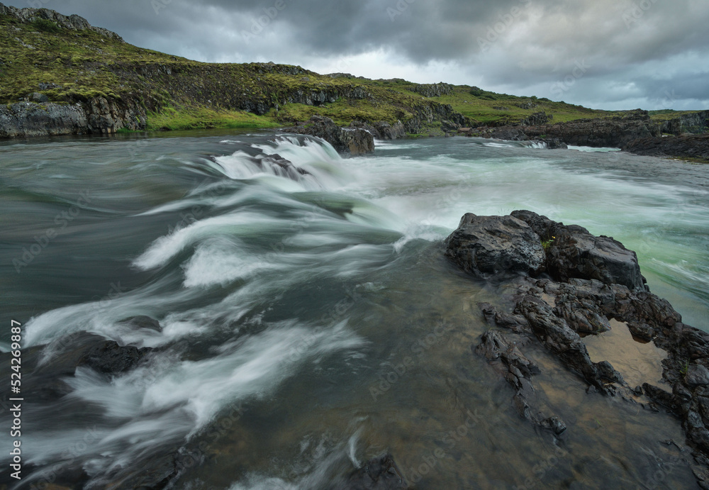  Waterfalls in long exposure on a river near Borganes and Husafell in Western Iceland.