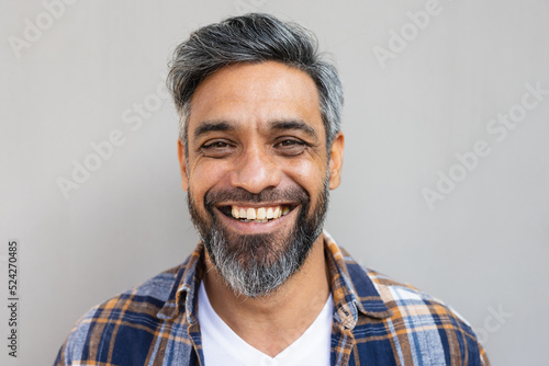 Portrait of happy biracial man wearing shirt and smiling