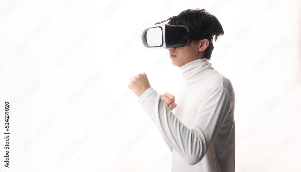Young man using virtual reality headset looking up and interacting with Facebook Youtube Steam VR content. Isolated on a white background studio portrait. VR, future, gadgets, technology, concept Young man using virtual reality headset looking up and interacting with Facebook Youtube Steam VR content. Isolated on a white background studio portrait. VR, future, gadgets, technology, concept