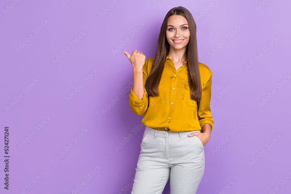 Photo of optimistic brown hair lady index promo wear brown shirt trousers isolated on purple color background Photo of optimistic brown hair lady index promo wear brown shirt trousers isolated on purple color background