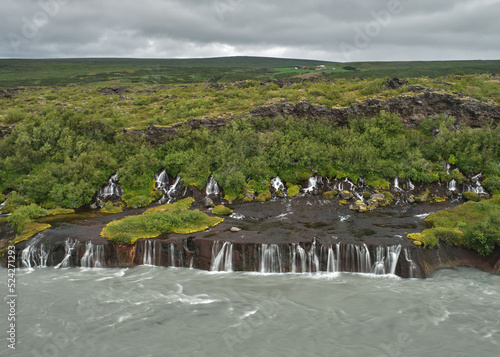 View of Hraunfossar waterfall flowing out of the lava near Husafell  Western Iceland.
