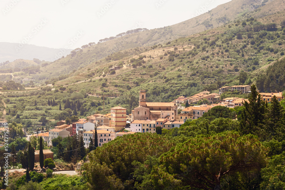 Capoliveri has unusual architecture, the town still retains its medieval appearance, with its narrow, picturesque vineyards and arcades known as chiassi. Island of Elba, Italy