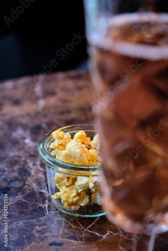 Seasoned popcorn as a predinner snack. photo