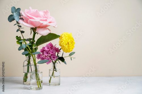 Flowers in vase with beautiful pink roses, yellow dahlia and pink hydrange bouquet, copy space.Greeting card.