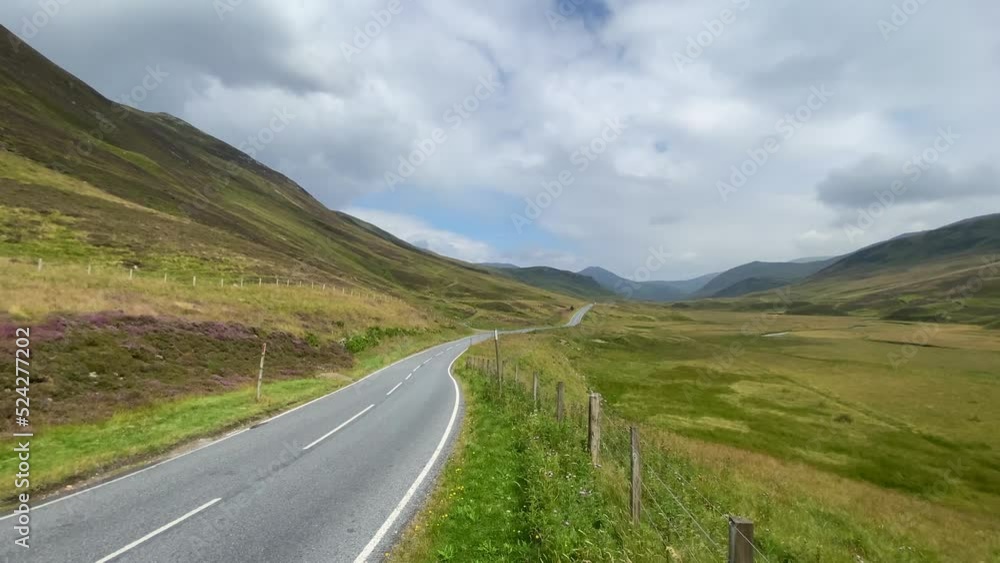 On the road along the Loch Lurgainn, Scottland. It is a large deep loch located north along the west coast from Ullapool, Scotland On the road along the Loch Lurgainn, Scottland. It is a large deep loch located north along the west coast from Ullapool, Scotland