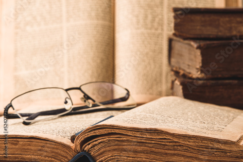 Shabby pages of worn old jewish books in leather binding. Reading Torah. Closeup. Selective focus.