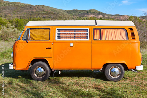 Obraz na płótnie Vintage camper van under a blue sky. Recreational vehicle. Summertime w salonie