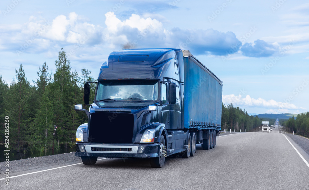 Truck transportation on island Finland road at sunny day. Concept banner logistic cargo speed