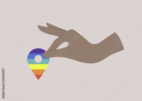 Hand placing a rainbow geo tag, LGBTQIA community safe space