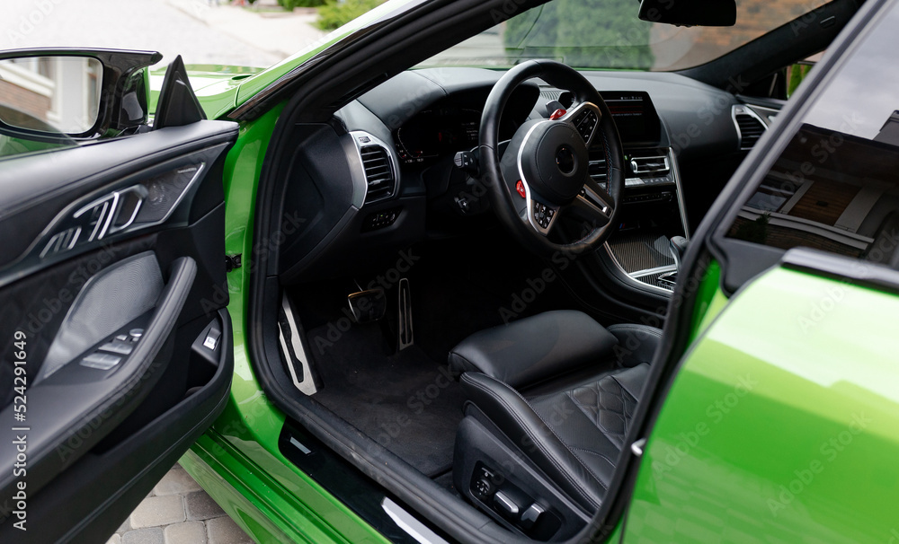 View to inside of modern salon of car through open door. View to inside of modern salon of car through open door.