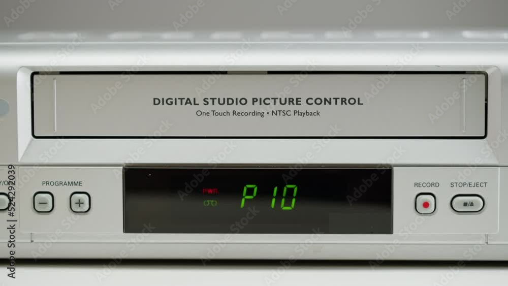 Old video recorder close-up, VHS. Retro player, vintage video cassette broadcasting, audio tape. Old video recorder close-up, VHS. Retro player, vintage video cassette broadcasting, audio tape.