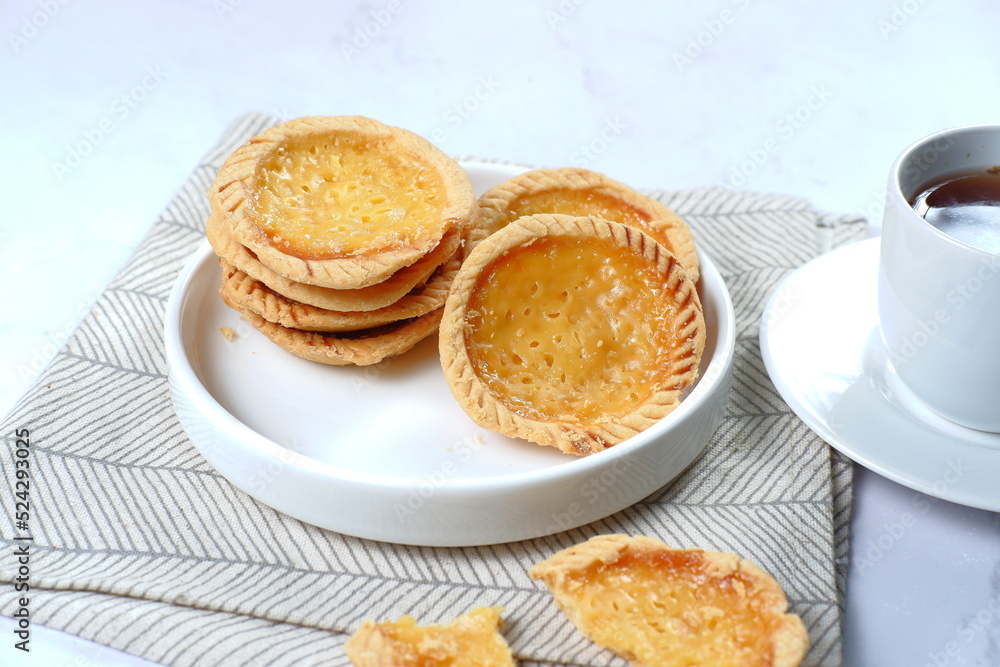 Pie Susu or custard tarts is popular snack from Bali, Indonesia.on white background Pie Susu or custard tarts is popular snack from Bali, Indonesia.on white background